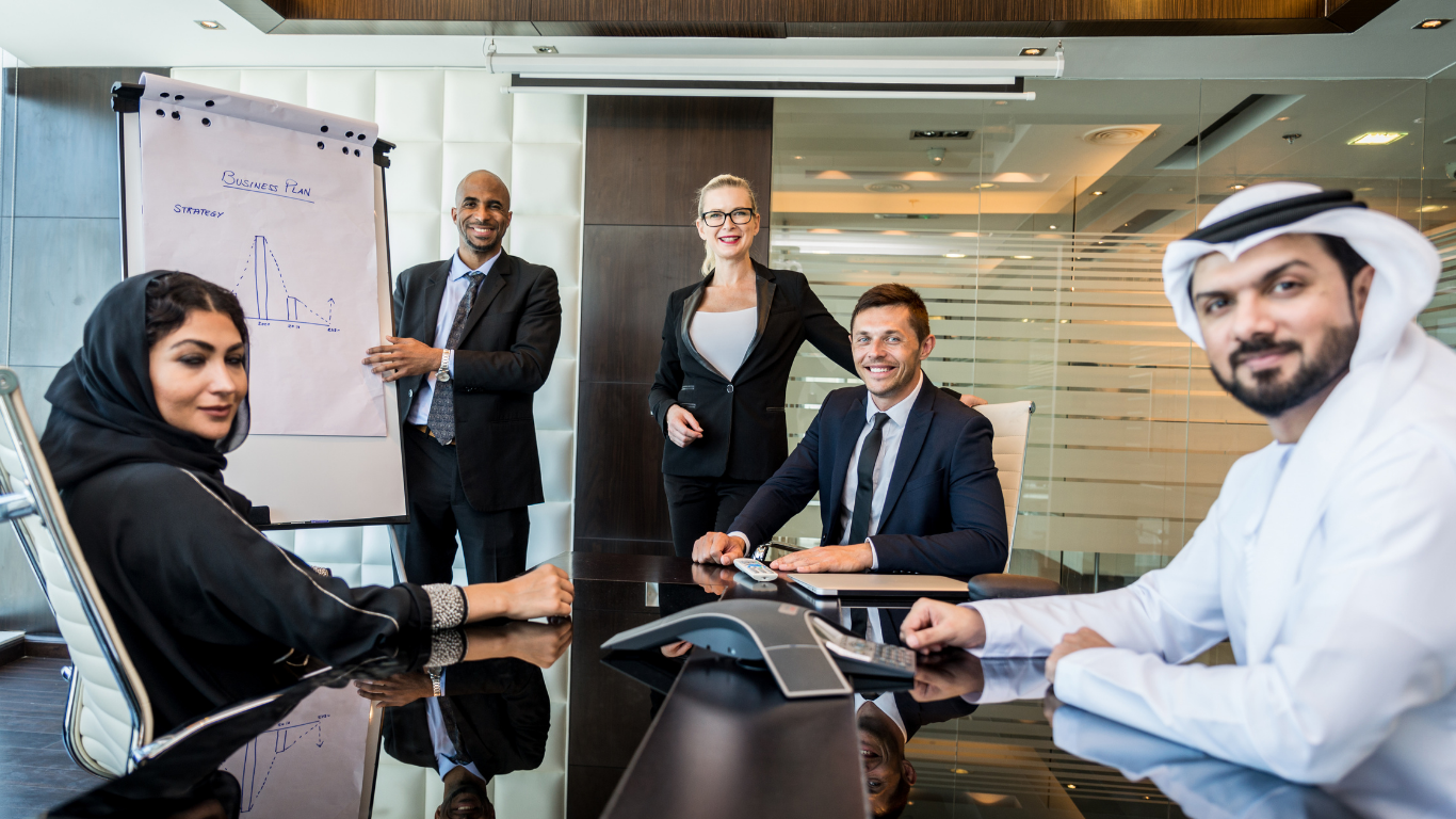 TCSP team walking and smiling in office hallway